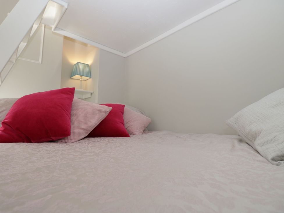 A bedroom with a bed and pillows at Hamilton's Studio in Ryde