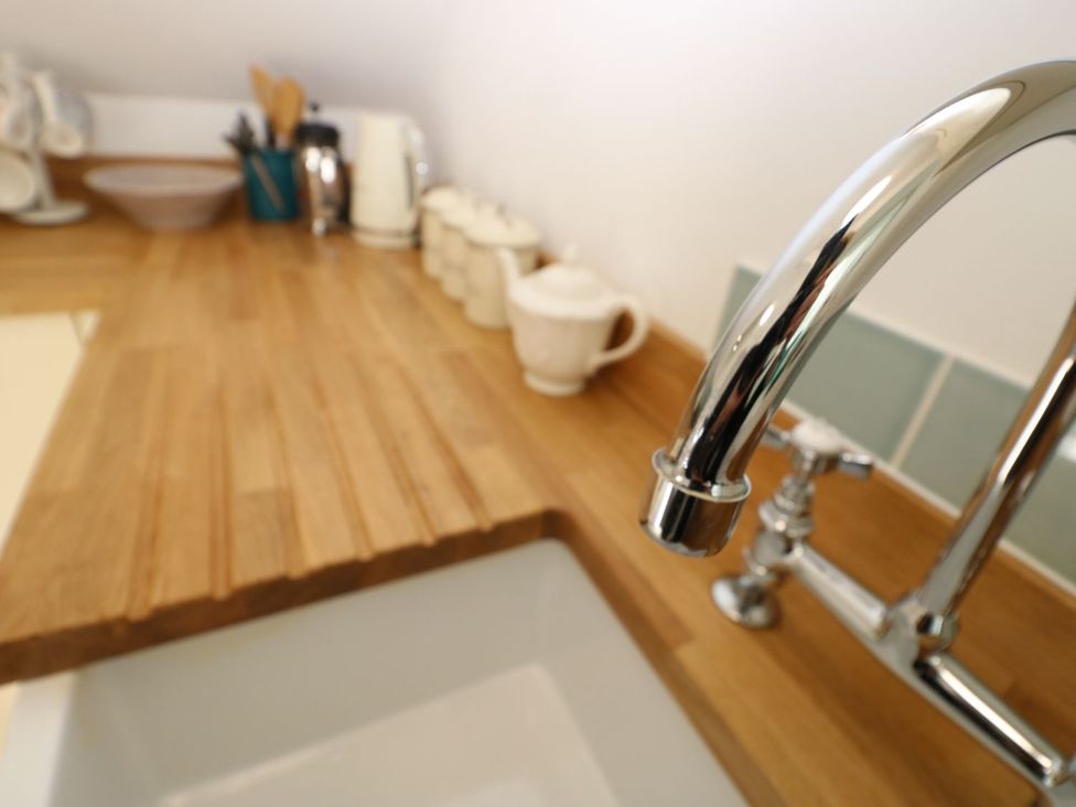 A kitchen with a sink and countertop at Hamilton's Studio in Ryde