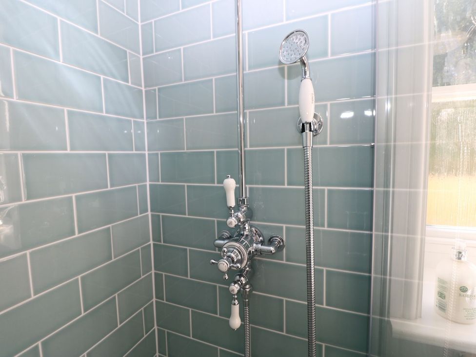 A shower setup with a showerhead and valve at Hamilton's Studio in Ryde