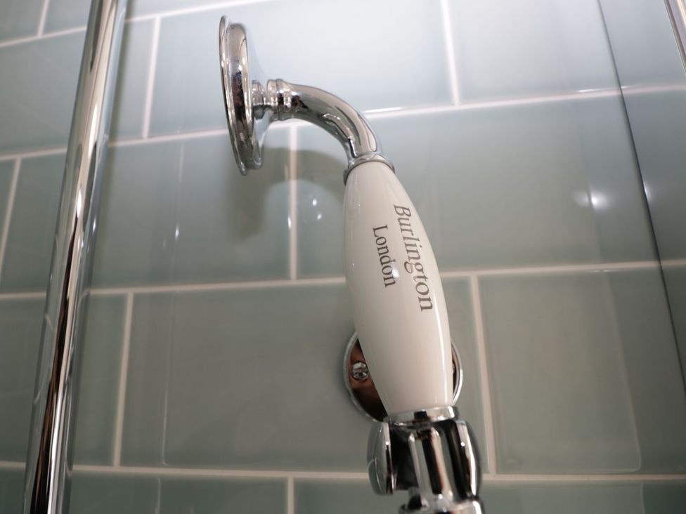 A shower head with Burlington London branding at Hamilton's Studio in Ryde