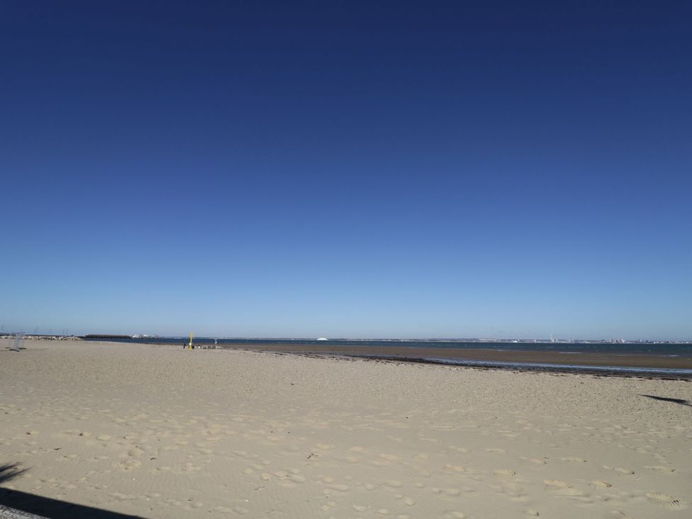 A beach with sand and water at Hamilton's Studio in Ryde