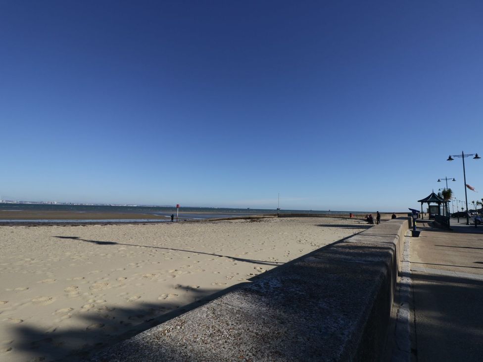 A beach view with sea and people at Hamilton's Studio in Ryde