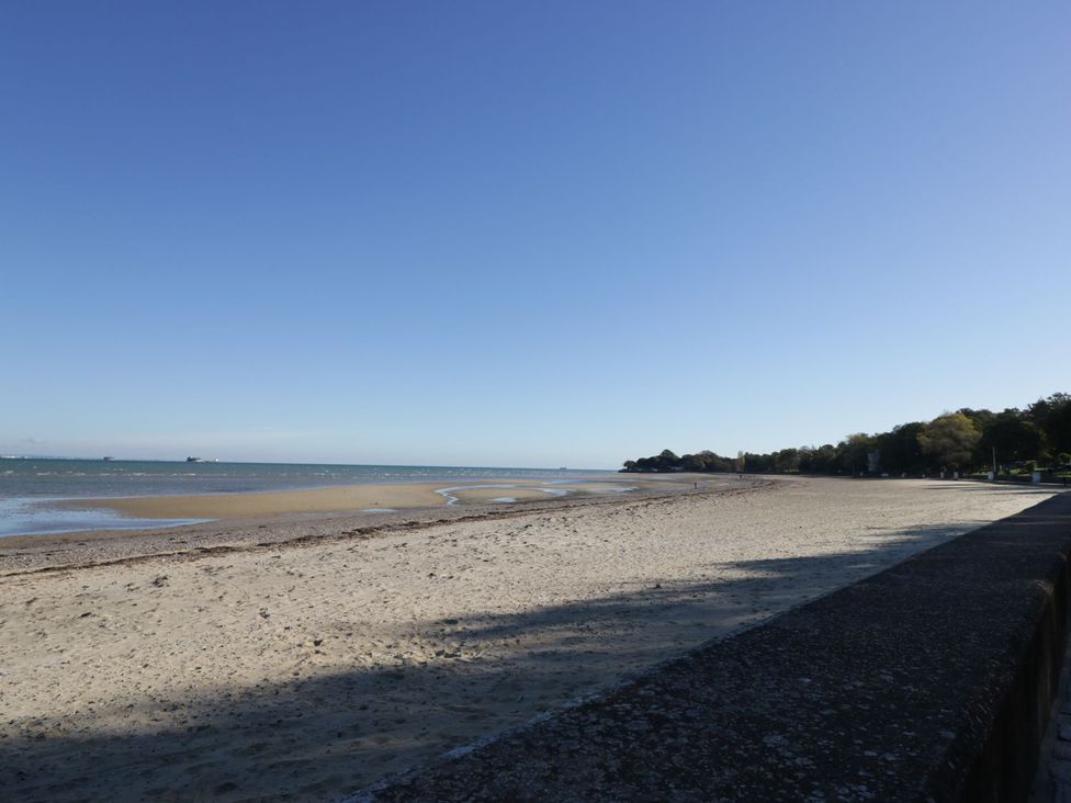 A beach with sand and water at Hamilton's Studio Ryde