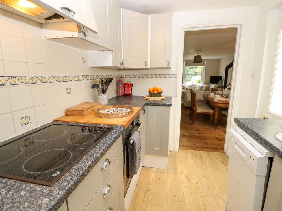 A kitchen with a countertop and stove at Fern Cottage in Bembridge