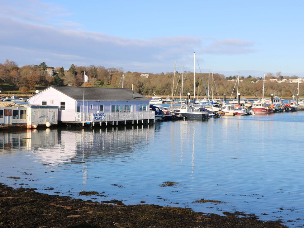 A seafood cafe by the marina with boats at Fern Cottage in Bembridge