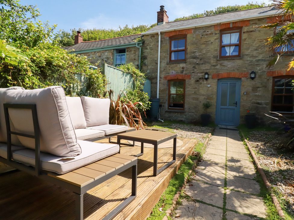 A garden with seating and pathway at 18 Tregea Terrace in Portreath