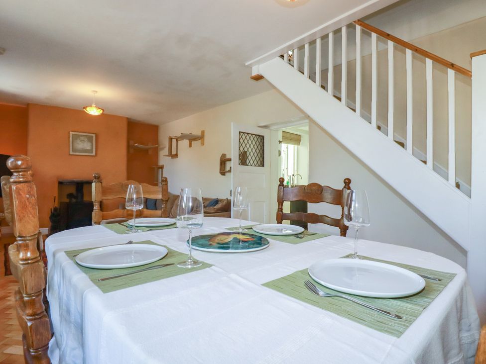A dining room with a table set for dining at 18 Tregea Terrace in Portreath