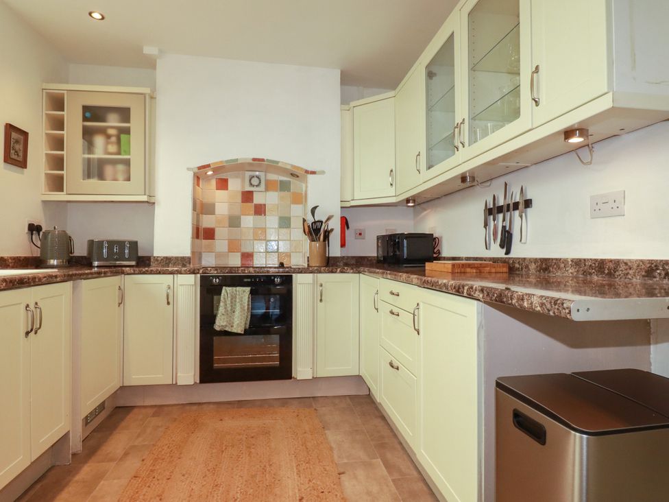 A kitchen with cabinets and appliances at 18 Tregea Terrace Portreath