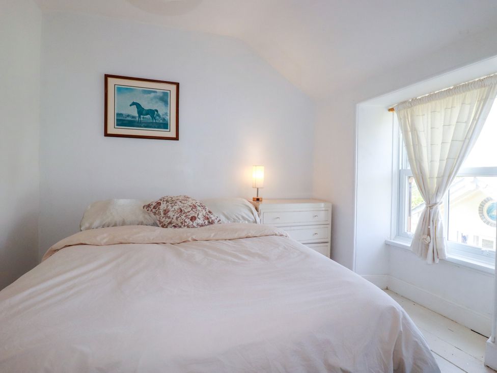 A bedroom featuring a bed and a dresser at 18 Tregea Terrace in Portreath
