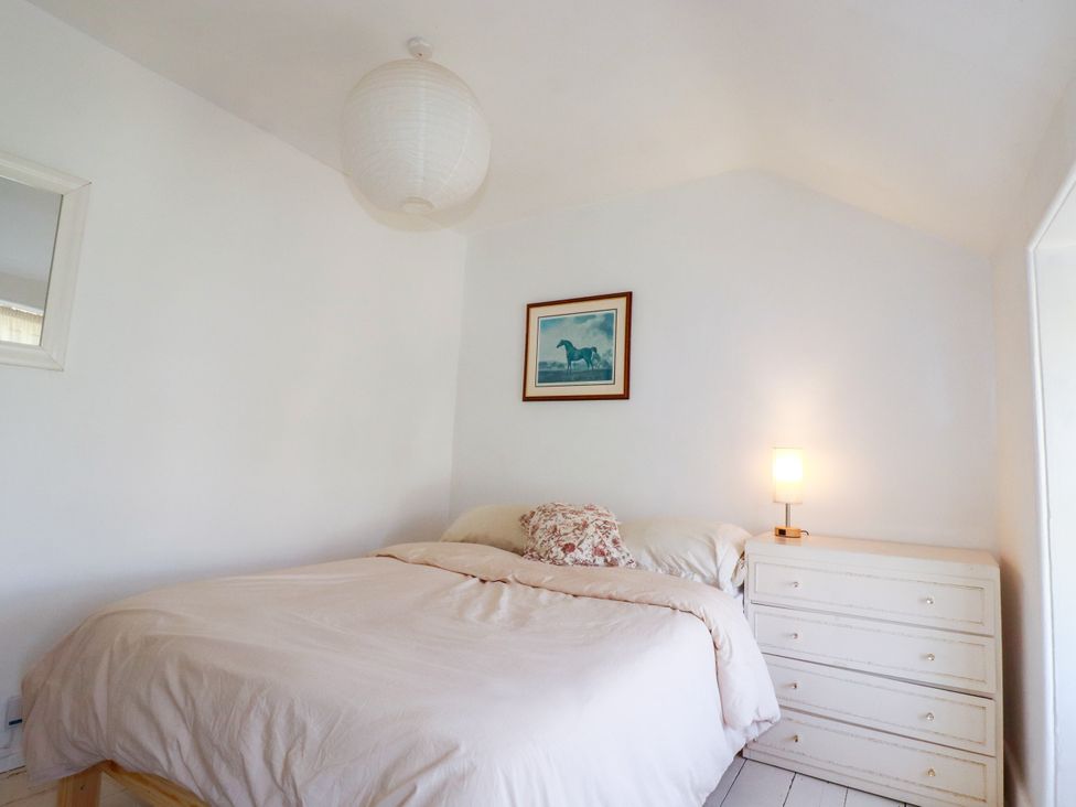 A bedroom with a bed and a dresser at 18 Tregea Terrace in Portreath