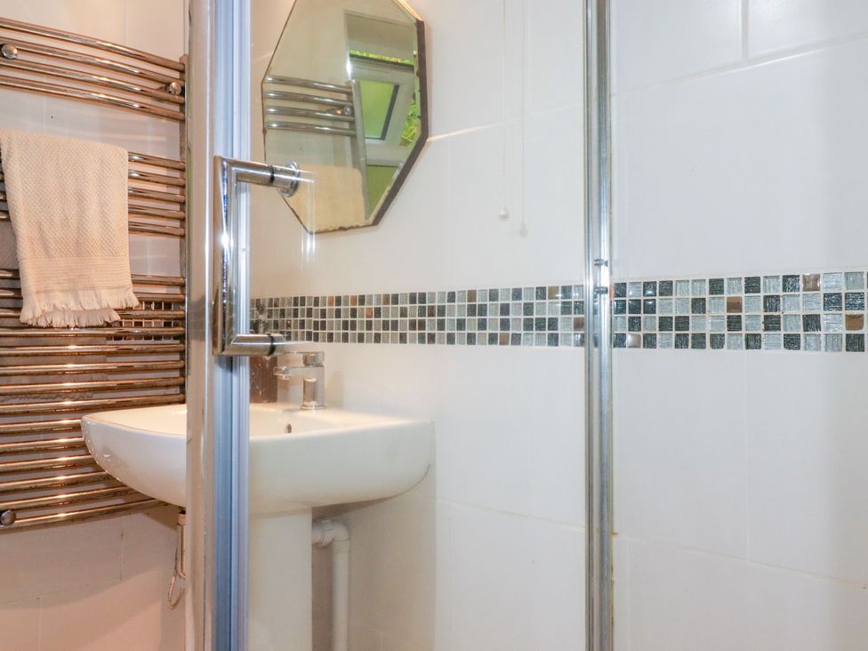 A bathroom with a shower and sink at 18 Tregea Terrace in Portreath