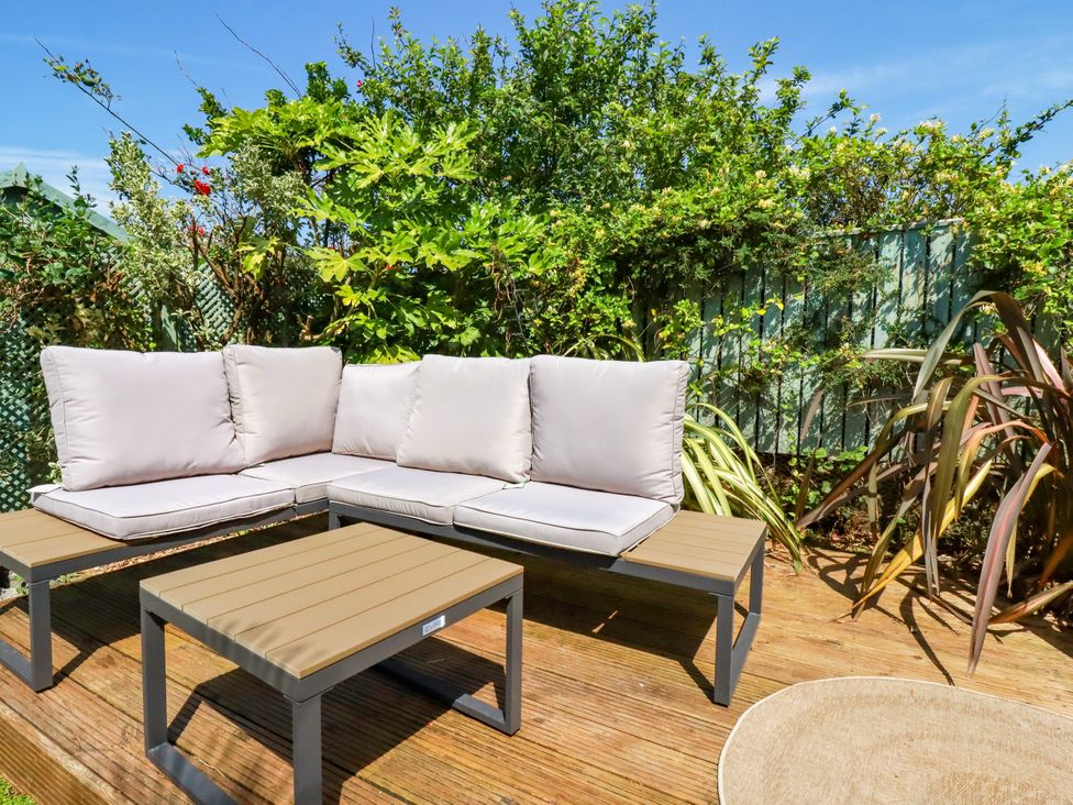 Outdoor seating area with a sofa set and coffee table at 18 Tregea Terrace Portreath