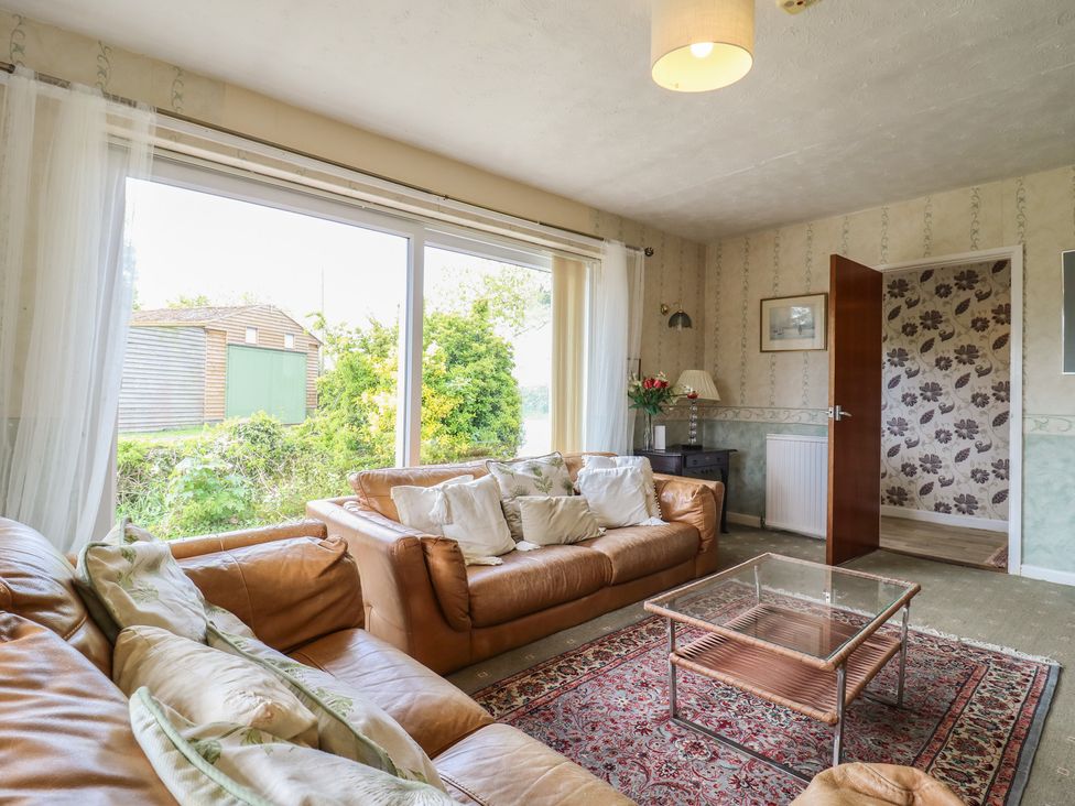 A living room with a sofa and coffee table at The Lodge 