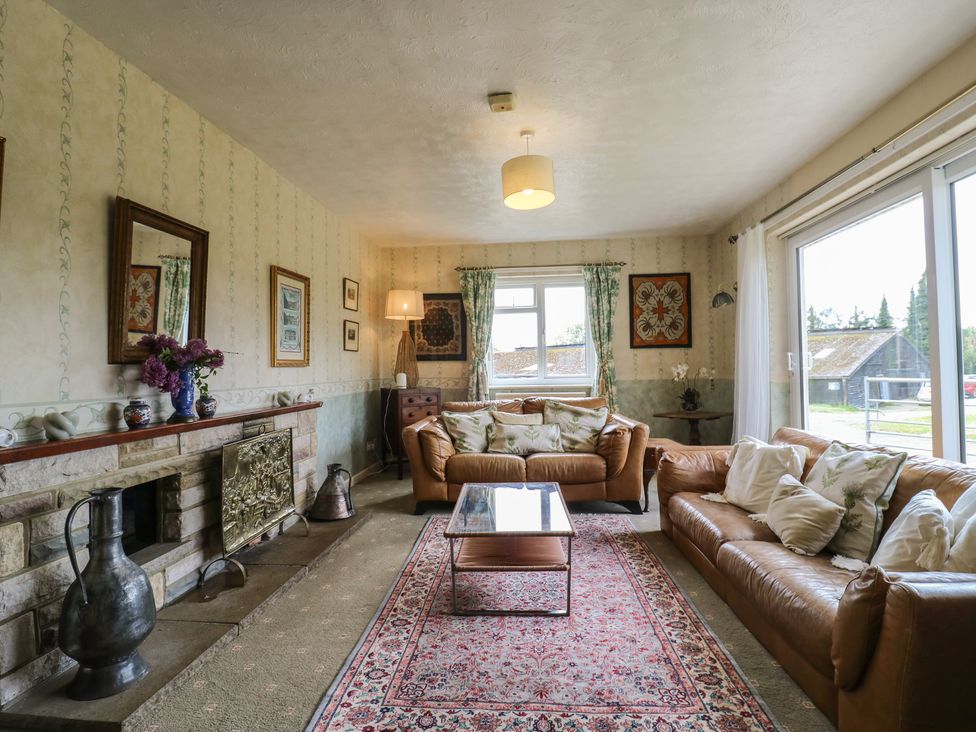 A living room with a sofa and coffee table at The Lodge 