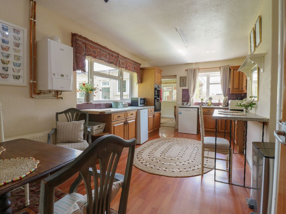 A kitchen with cabinets and appliances at The Lodge in 