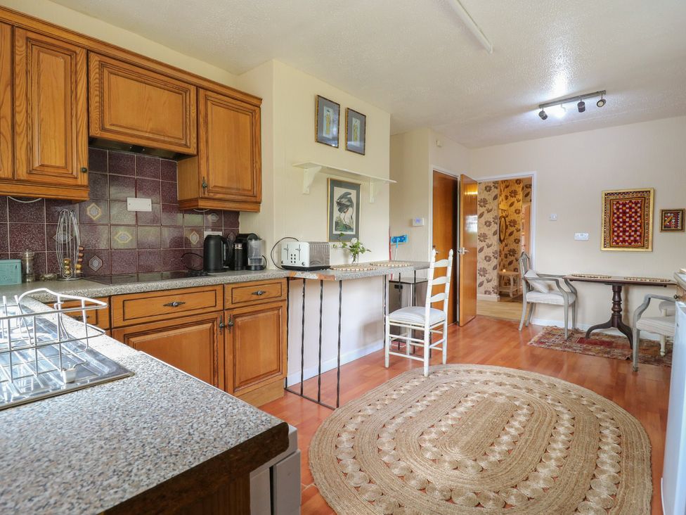 A kitchen with cabinets and countertop at The Lodge 
