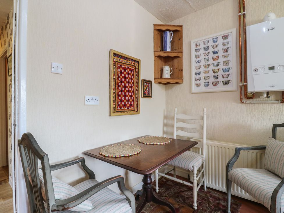 A dining room with a table and chairs at The Lodge 