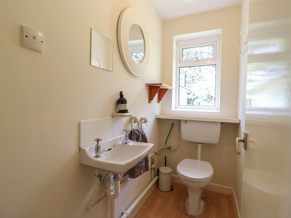 A bathroom with a sink and toilet at The Lodge 