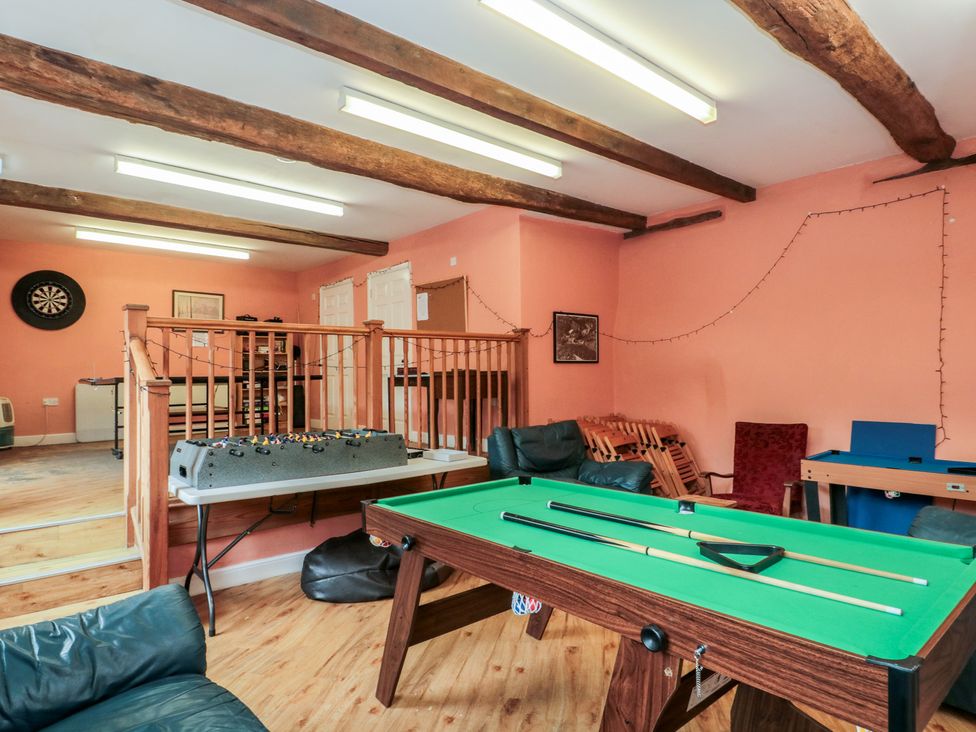 A games room with a billiard table and a darts board at Longfords Mill, Minchinhampton