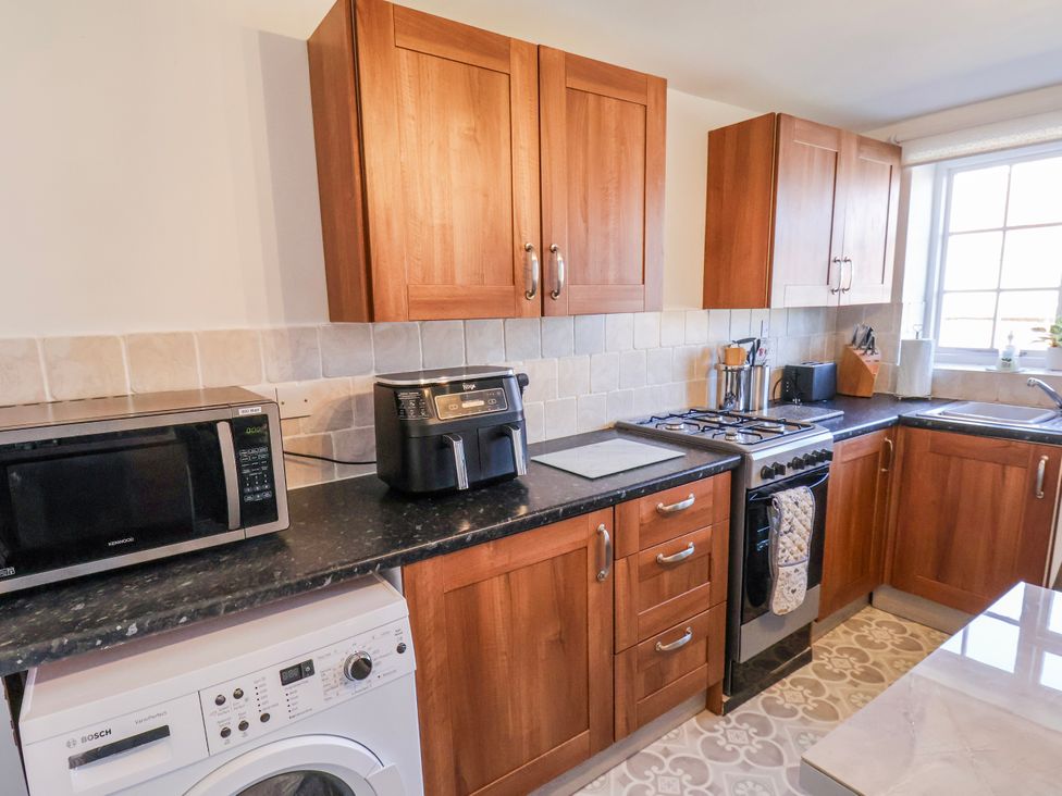 A kitchen with appliances on counters at 1 West Ville Mews in York