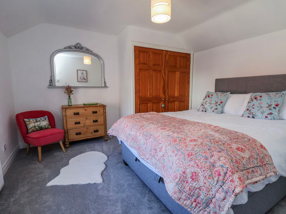 A bedroom with a bed and furniture at 1 West Ville Mews York
