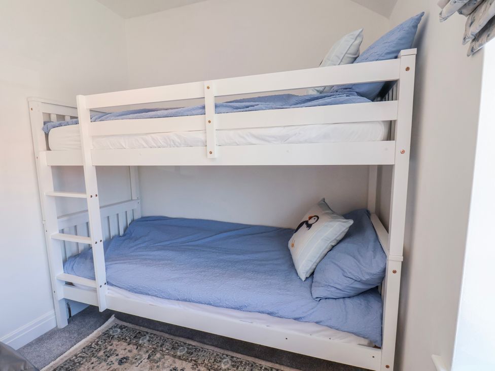 A bunk bed with blue bedding at 1 West Ville Mews in York