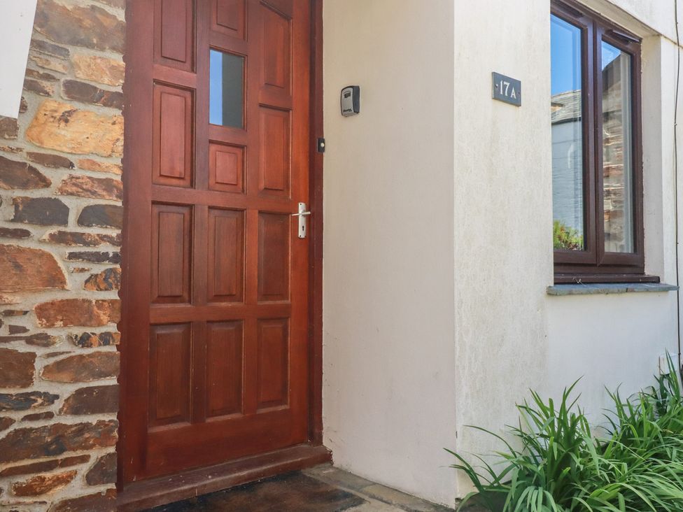 A front door and window at Stowaway Cottage in Padstow