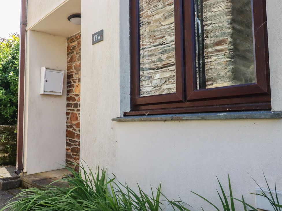 A property entrance with a mailbox and window at Stowaway Cottage in Padstow