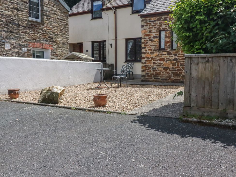 An outdoor space with a table and chairs at Stowaway Cottage in Padstow