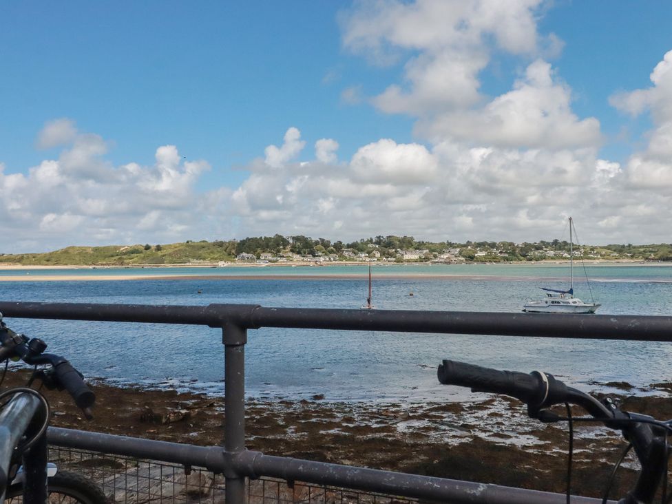 A view of water with boats and land at Stowaway Cottage in Padstow