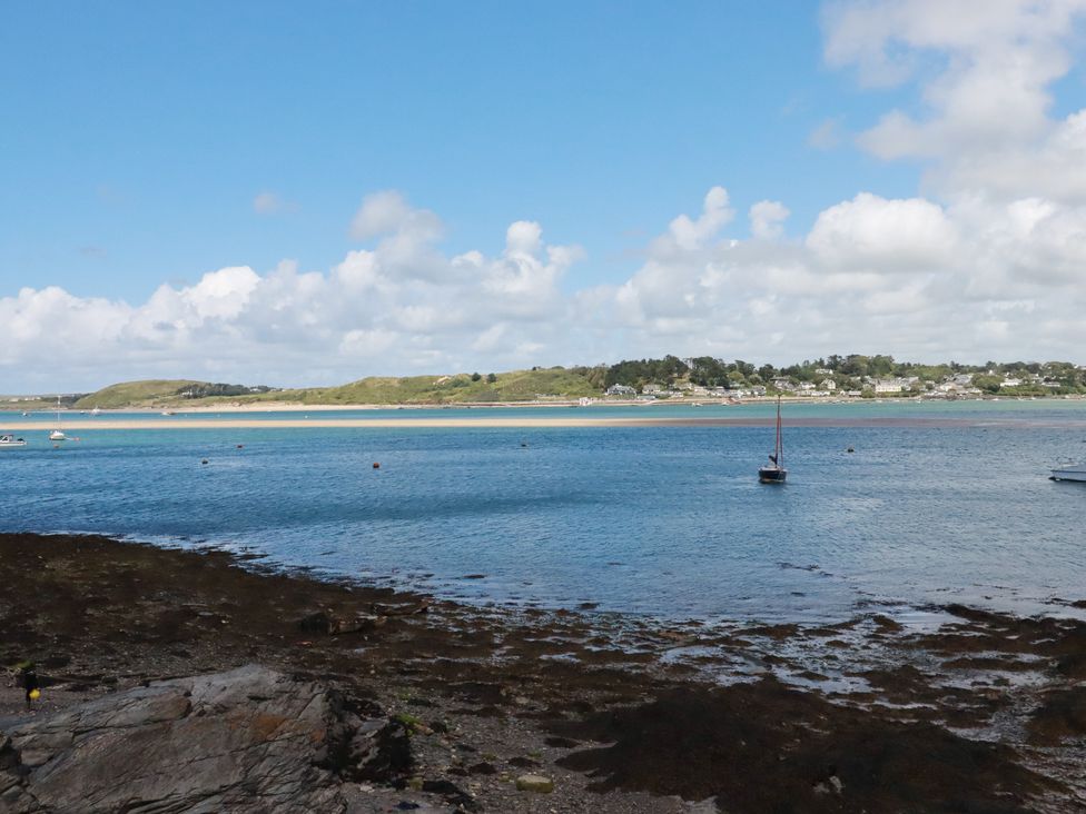 A view of boats on water and shoreline at Stowaway Cottage in Padstow