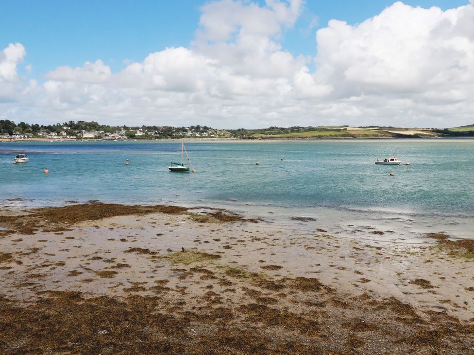 A view of the sea with boats and seaweed at Stowaway Cottage in Padstow