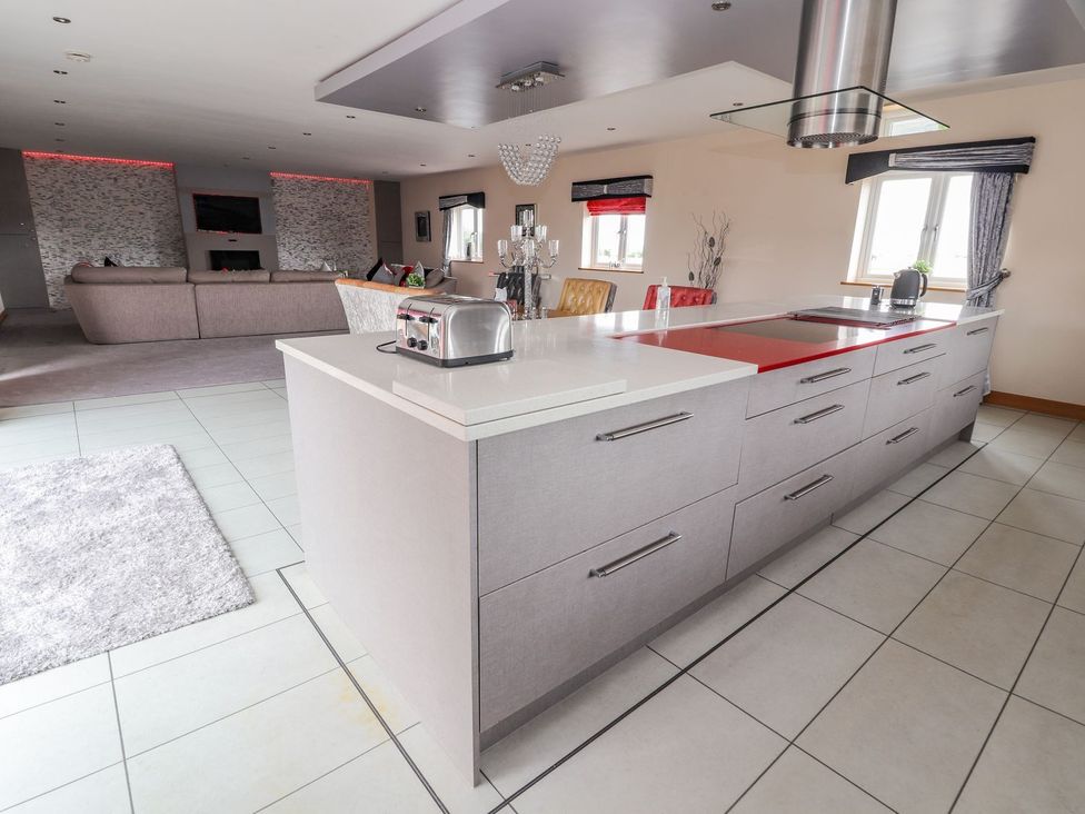 A kitchen with an island and toaster at The Wendover Abergele