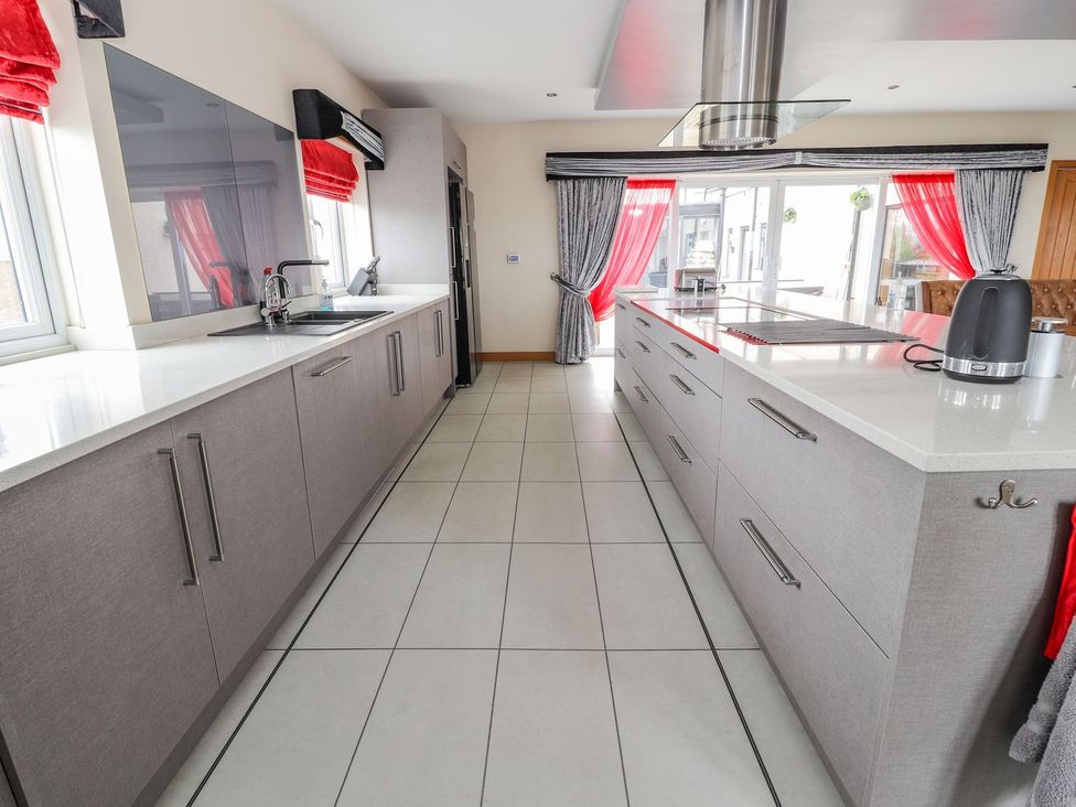 A kitchen with cabinets and a sink at The Wendover in Abergele