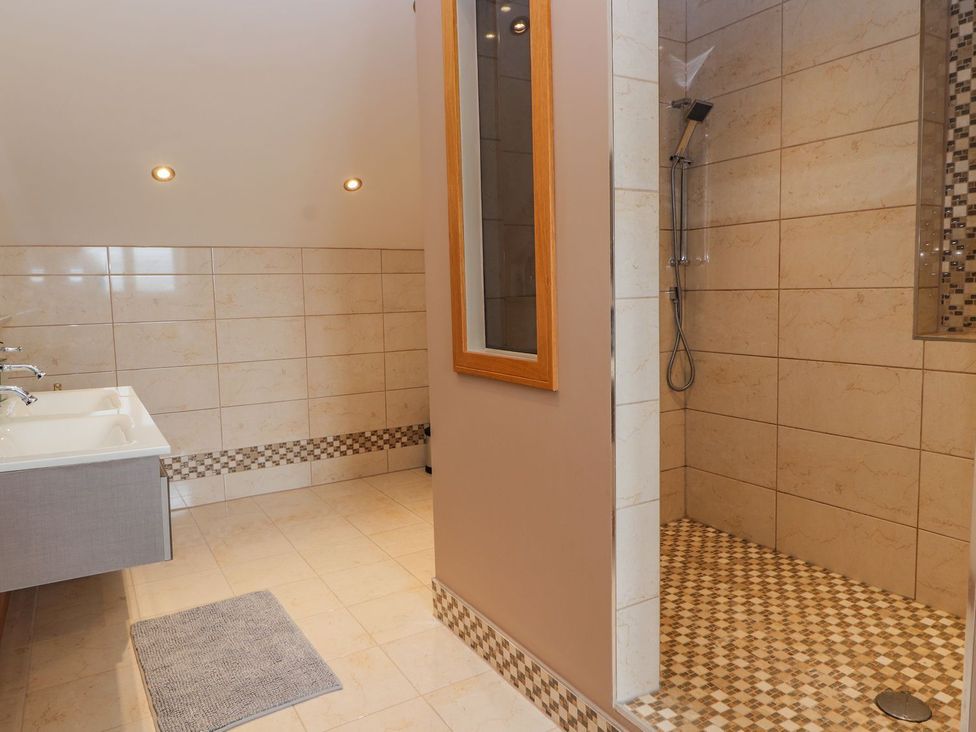 A bathroom with a sink and shower at The Wendover in Abergele