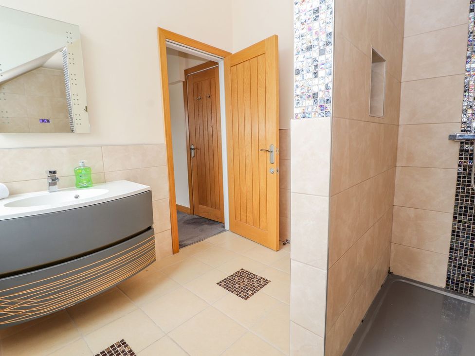 A bathroom with a sink and shower at The Wendover in Abergele
