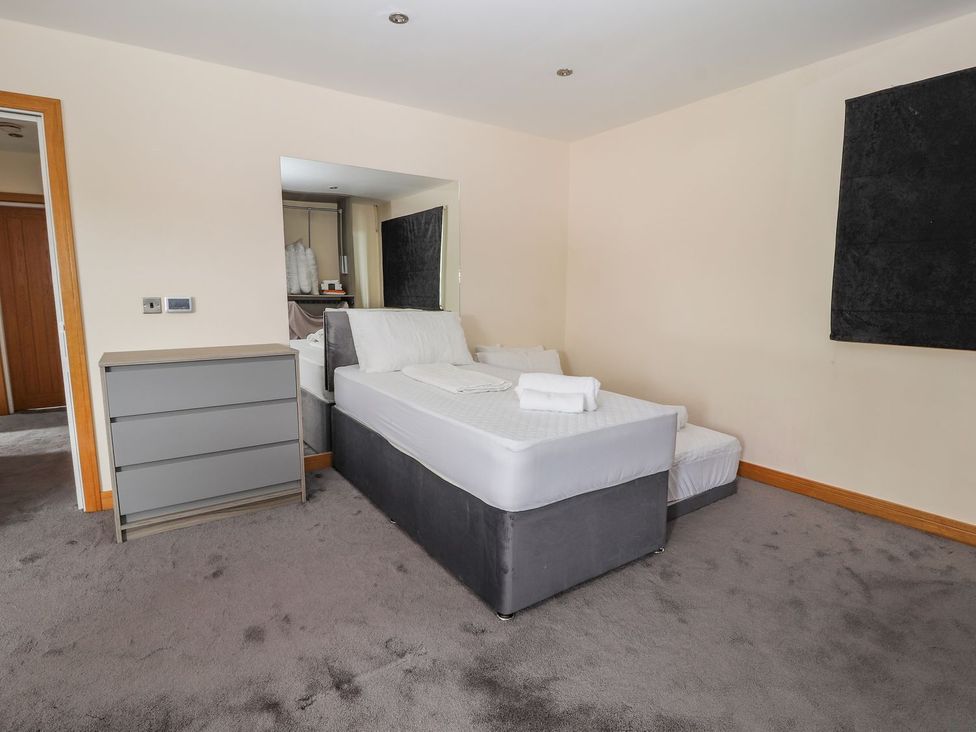A bedroom with a bed and a drawer at The Wendover in Abergele
