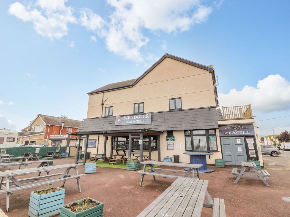 An outdoor dining area with tables at The Wendover in Abergele