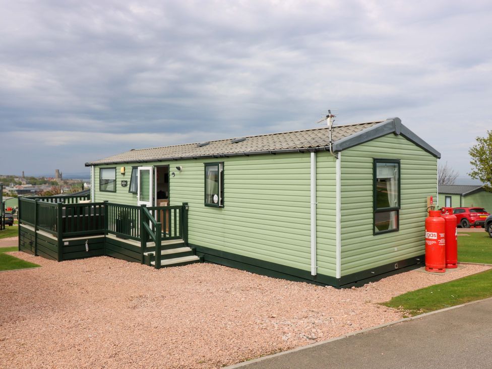 A mobile home with a deck and gas cylinder at 18 Eden Heights in St Andrews