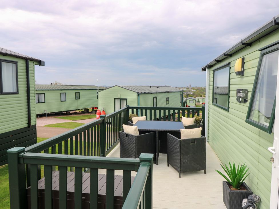 A deck with outdoor furniture at 18 Eden Heights in St Andrews