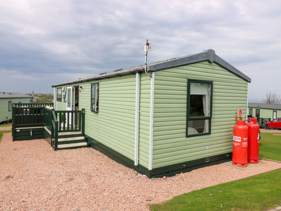 A mobile home with a deck and gas cylinders at 18 Eden Heights in St Andrews