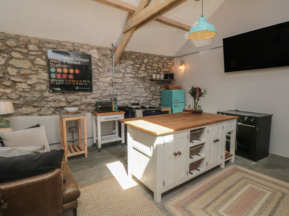 A kitchen with a kitchen island and appliances at 1 bed in York