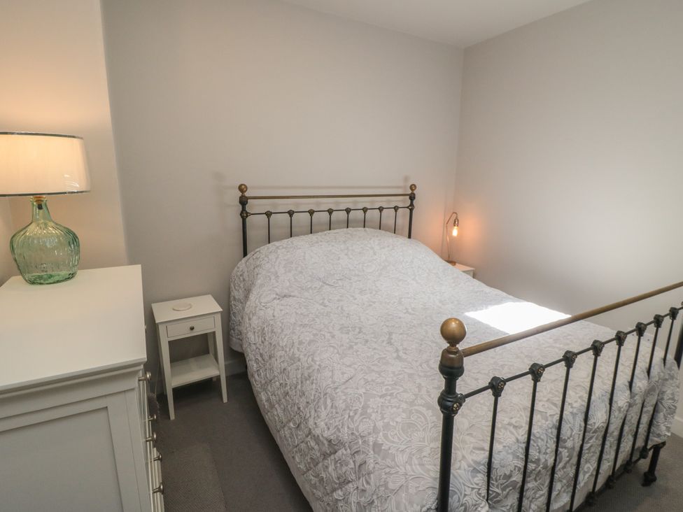 A bedroom with a bed and lamp at 1 bed in York
