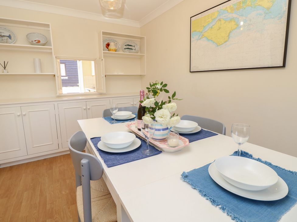 A dining room with a table set for four at Anchorage House Seaview