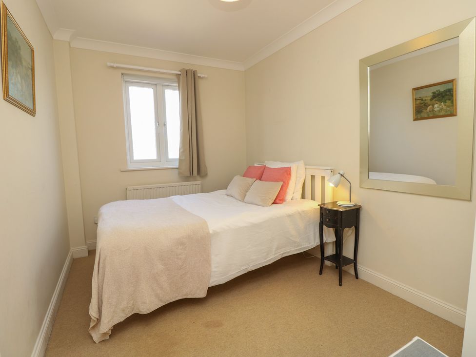 A bedroom with a bed and nightstand at Anchorage House in Seaview