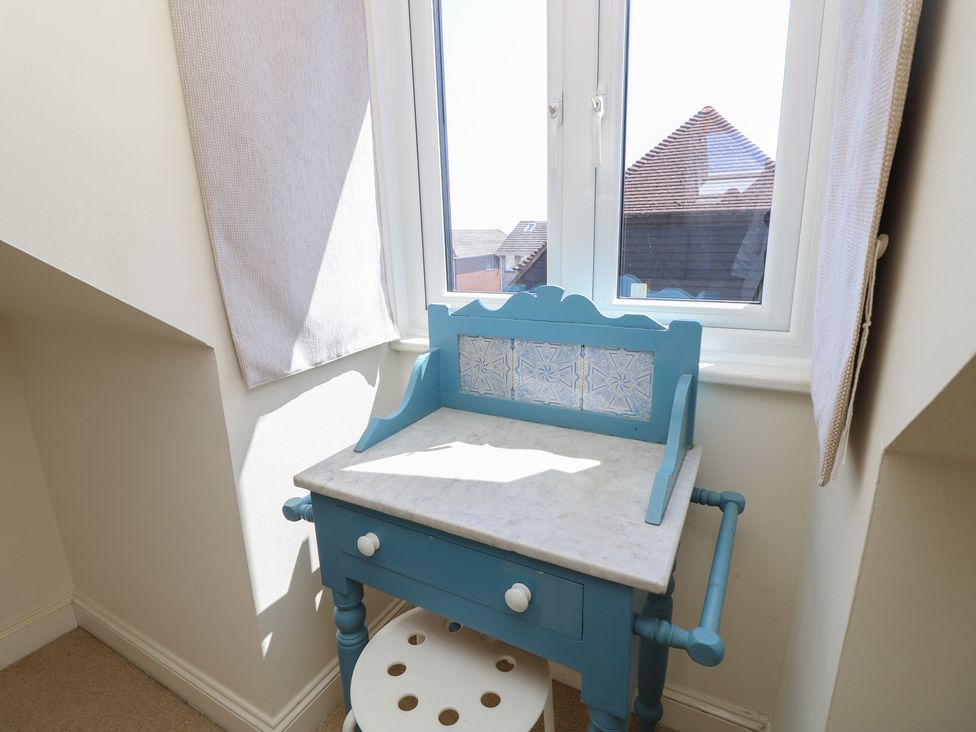 A desk with a marble top and window at Anchorage House Seaview
