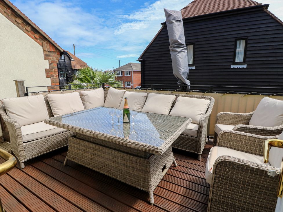 An outdoor seating area with a sofa and coffee table at Anchorage House Seaview