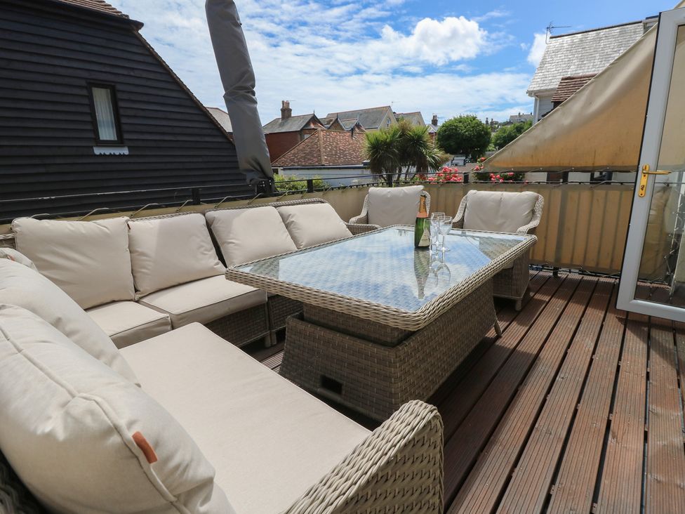 A seating area with a glass table and sofa at Anchorage House Seaview