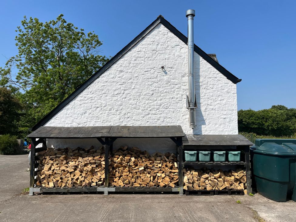 Wood storage and bins at Swallow Cottage near Cowbridge
