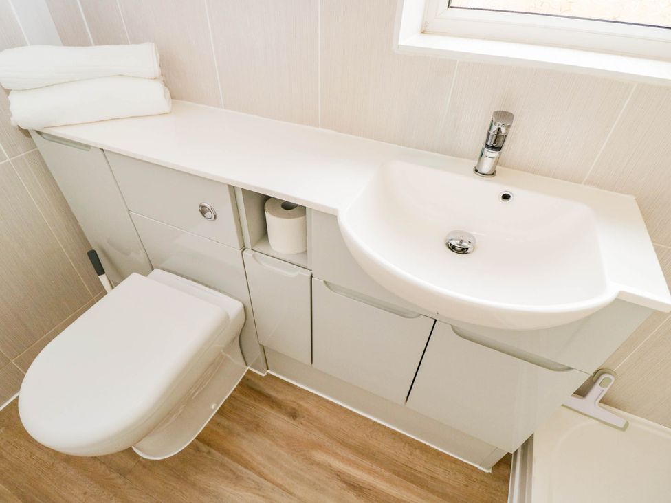 A bathroom with a sink and toilet at 3 Station Road Weston-Super-Mare